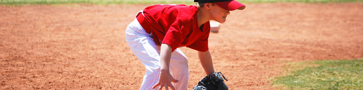 Young player ready to field a ground ball